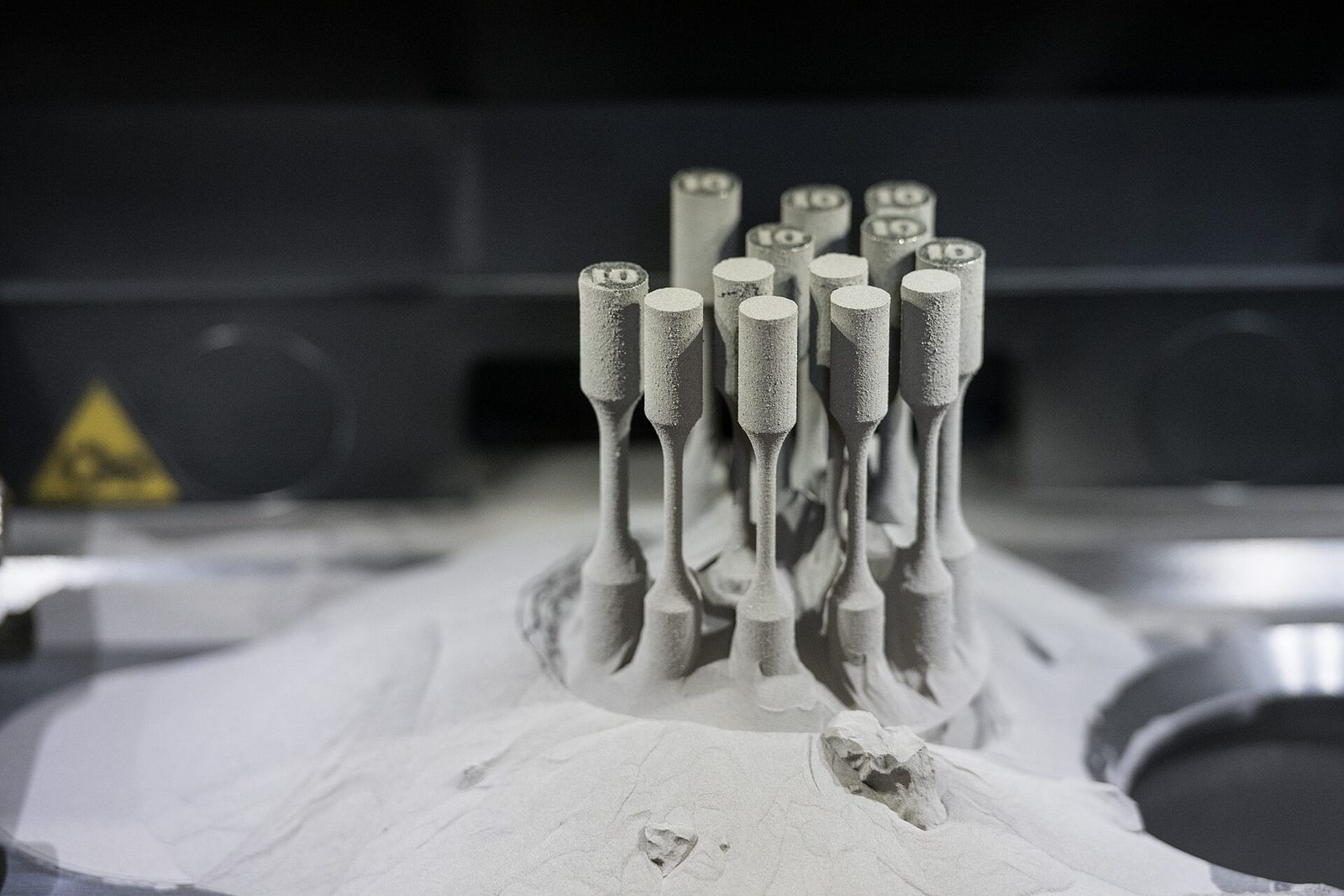 TRUMPF TruPrint 1000 is a metal 3D printer utilizing the selective laser melting (SLM) technology. View of the printing chamber with finished prints. FZU – Institute of Physics of the Czech Academy of